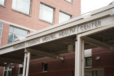 entrance to Tompkins County Mental Health Services, building sign says Tompkins County Mental Health Center