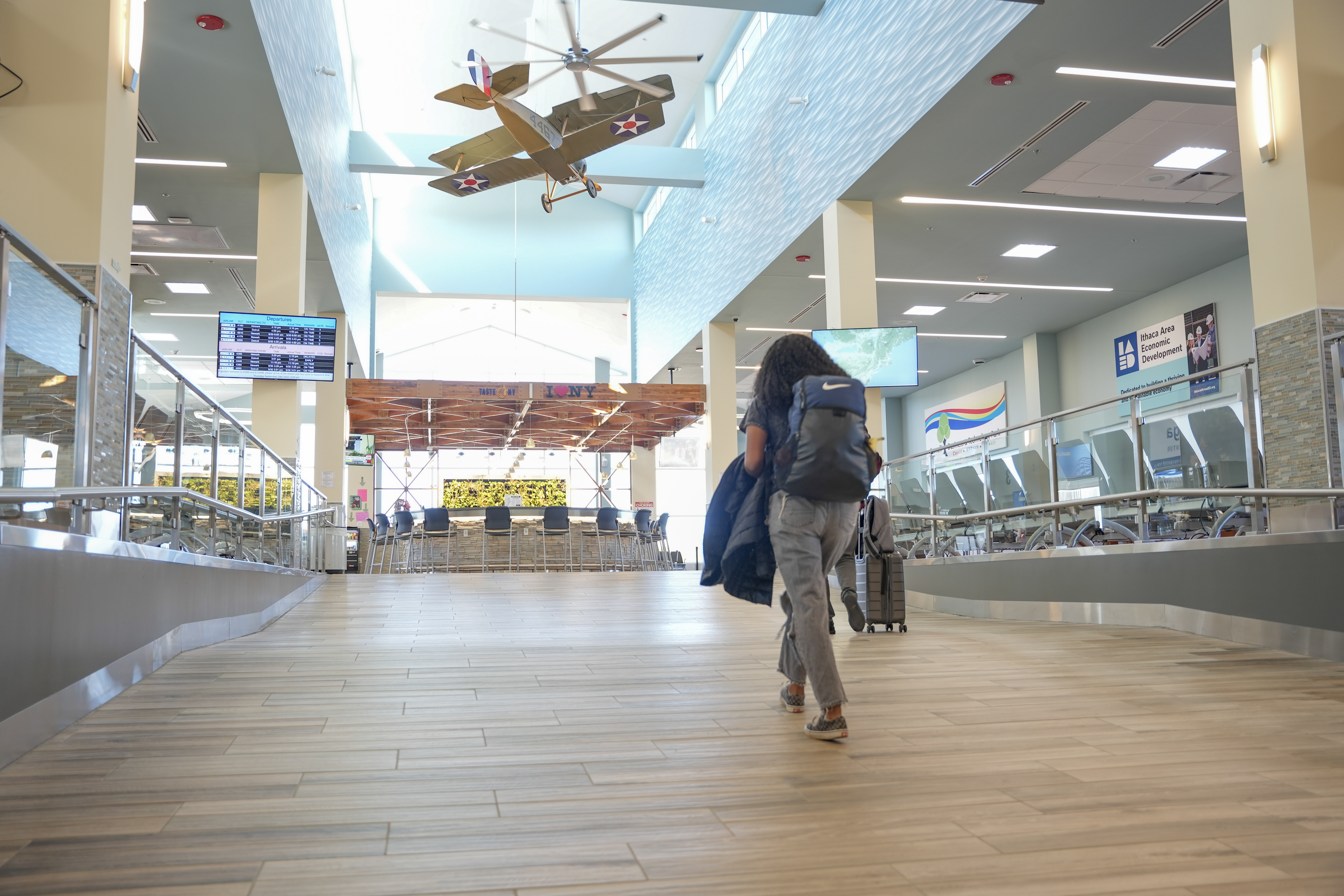 Patron walking through the airport terminal