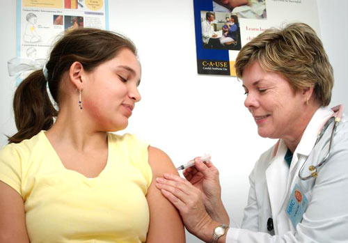 Image of teen getting a flu shot--CDC Public Health Image Library No9297