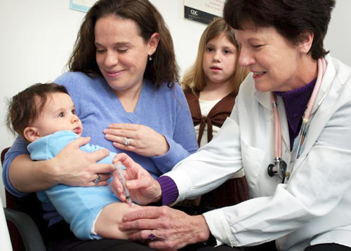 Image of a baby getting a flu shot--CDC Public Health Image Library No9353