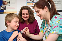Pre-teen boy receives vaccination. Photo Credit: James Gathany, CDC.